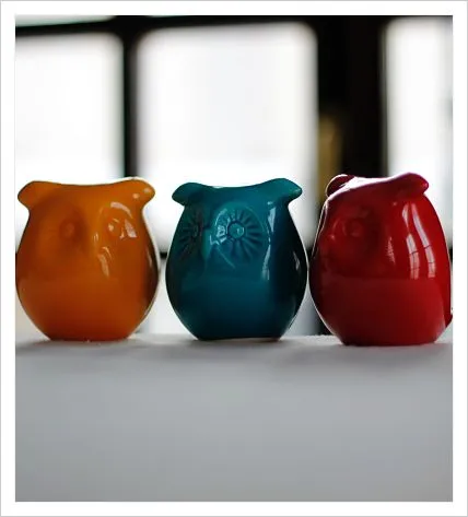 Three ceramic owl figurines
